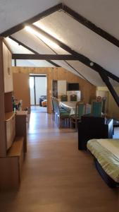 a room with a bed and a dining room and a kitchen at Gödelsteinhof in Contwig