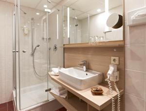 
Ein Badezimmer in der Unterkunft Weinberghotel Edelacker
