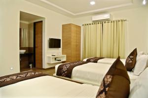 Uma cama ou camas num quarto em Hotel Grand Ecotel, Aurangabad