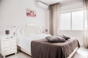 Tempat tidur dalam kamar di Cozy Apartment (La Orquídea)