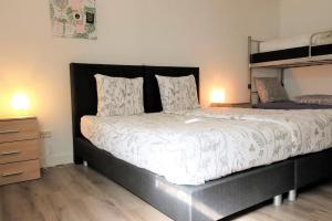 a bedroom with a bed and a bunk bed at Gretel von Birne in Winterberg