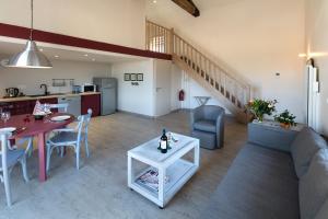 a living room with a couch and a table at Appartement La Haute Preze & Golffrance in Rouzède