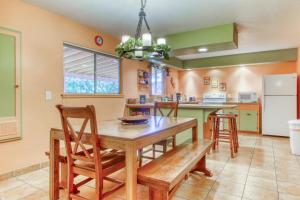 a kitchen with a wooden table and chairs at Creekside Juanita's Place in Moab