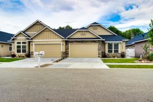 a house with a garage on a street at Sunglow Townhouse in Boise