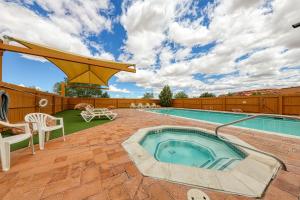 a swimming pool with a hot tub on a patio at Rim Village O3 in Moab