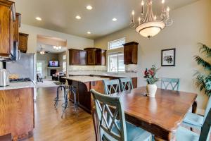 a kitchen and dining room with a wooden table at Sunglow Townhouse in Boise