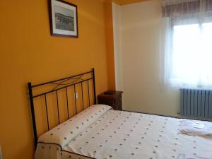 Posteľ alebo postele v izbe v ubytovaní Hostal Atila