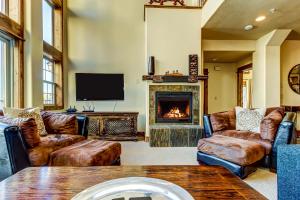 a living room with leather furniture and a fireplace at White Bear #B12 - Heavenly Bear at White Bear in Brian Head