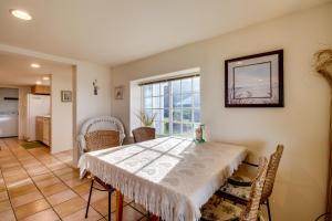 a dining room with a table and chairs at Hale Kaalawai Unit B in Oceanside