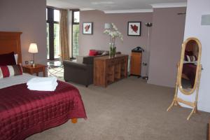 A bed or beds in a room at Gomersal Park Hotel & Dream Spa