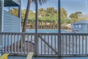 a view from the balcony of a house with a swimming pool at 104 Inlet Sands Condo in Inlet Beach