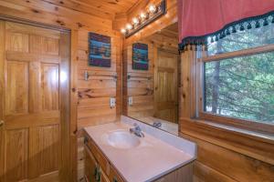 a bathroom with a sink and a window at Rendez-View in Henderson Springs +42 photos