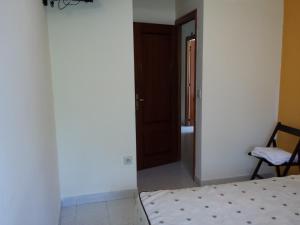 A bed or beds in a room at Hostal Atila