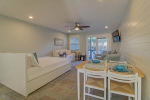 a living room with a couch and a table at 104 Inlet Sands Condo in Inlet Beach