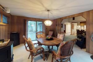 a kitchen and dining room with a table and chairs at Island Getaway in Oak Bluffs