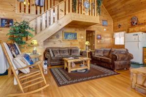 a living room with couches and a staircase in a cabin at An Indian Dream in Henderson Springs