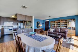 a kitchen and living room with a table and a couch at Vintage Views in Cayucos