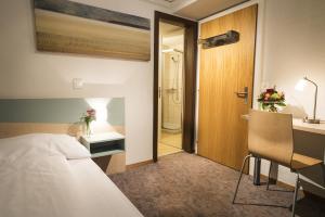 Voodi või voodid majutusasutuse Hotel Kreuz toas