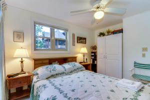 a bedroom with a bed and a window at Driftwood #6 in McHenry +22 photos