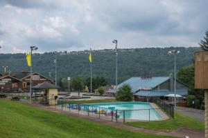 a large swimming pool in a town with a mountain at Driftwood #6 in McHenry