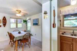 a kitchen and dining room with a table and chairs at Driftwood #6 in McHenry