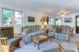 a living room with two couches and a table at Driftwood #6 in McHenry