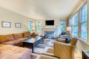 a living room with a couch and a table at Washburne Park Retreat in Eugene