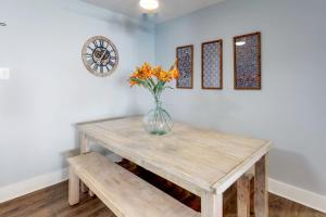 a vase of flowers sitting on a wooden table at Braemar Towers 209 in Ocean City +29 photos