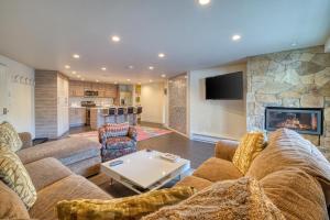 a living room with a couch and a fireplace at Fallridge in Vail