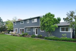 a gray house with a yard at Highland Park House in Walla Walla