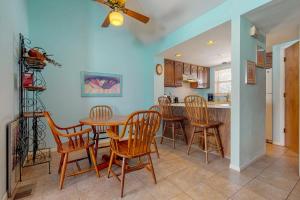 a kitchen and dining room with a table and chairs at Aspenwood 4229-30 in Pagosa Springs