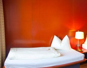 Letto o letti in una camera di Rosenberger Motor-Hotel Ansfelden