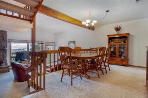 a dining room with a table and chairs at Camelot on Deer Mountain - Permit #3109 in Estes Park