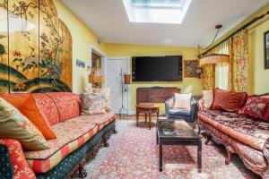 a living room with two couches and a tv at Vintage Rockport Escape in Rockport