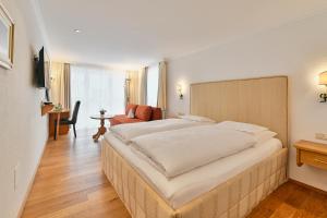 Voodi või voodid majutusasutuse Hotel Garni Sursilva toas