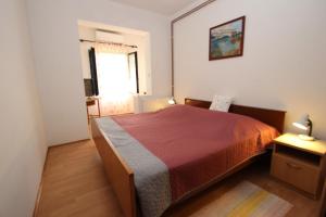 Łóżko lub łóżka w pokoju w obiekcie Apartments Saša - pets friendly!