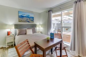 a bedroom with a bed and a table and chairs at Mercer Island- Mt Saint Helens Room in Mercer Island