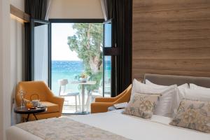 Voodi või voodid majutusasutuse Seasabelle Hotel near Athens Airport toas