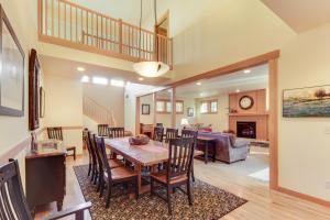 a dining room and living room with a table and chairs at 29 Fremont Crossing in Sunriver