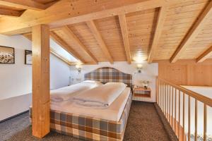 Voodi või voodid majutusasutuse Hotel Garni Sursilva toas