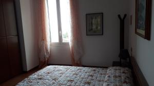 Postel nebo postele na pokoji v ubytování Appartamento Olimpo