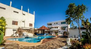 a swimming pool in the middle of a building at Casa Opuntia in Puerto Baquerizo Moreno