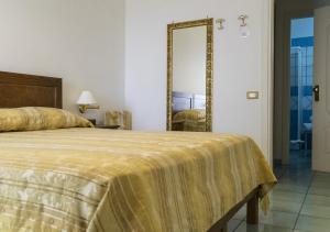 Postel nebo postele na pokoji v ubytování Hotel Baia