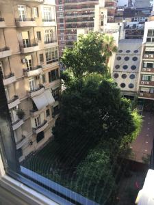 a view from a window of a building with a tree at Castex Palermo Chico in Buenos Aires