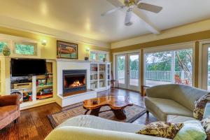 a living room with a couch and a fireplace at 6 Bed 4 Bath Vacation home in Eastsound in Eastsound