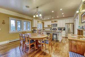 a kitchen with a wooden table and chairs at 6 Bed 4 Bath Vacation home in Eastsound in Eastsound