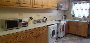 Kuchyň nebo kuchyňský kout v ubytování Swales cottage