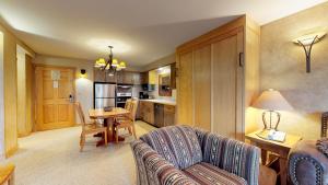 a living room with a couch and a table at Shoshone 1917 in Big Sky