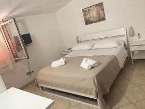 Postel nebo postele na pokoji v ubytování Hotel Due Pini Conte
