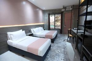 Voodi või voodid majutusasutuse Zenvea Hotel toas